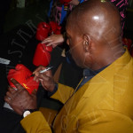 Boxing Legend Frank Bruno signing gloves